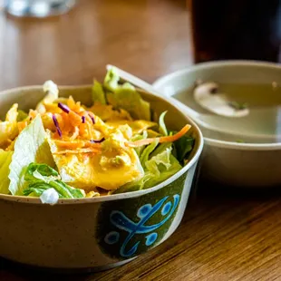 a bowl of salad and a bowl of soup