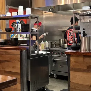 two people in a kitchen