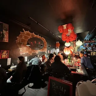 a group of people sitting at a bar