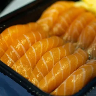 a close up of a tray of sushi