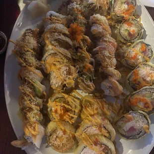 Crazy girl roll, mountain roll, spicy pacific roll, Godzilla, white tiger, bonfire.