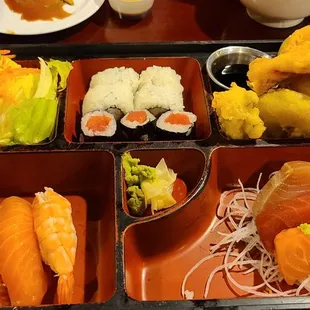 a tray of different types of sushi