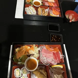 two trays of food on a table