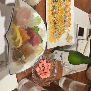a variety of sushi dishes on a table