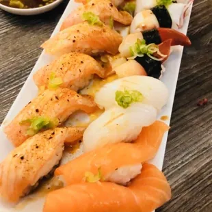 Cajun salmon Susi, Unagi (eel) Sushi, Red (surf) Clam Sushi, Squid Sushi, and Salmon Sushi