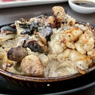 Dynamite ($11) hot appetizer with shrimp, bay scallop, mushroom, onion cream sauce