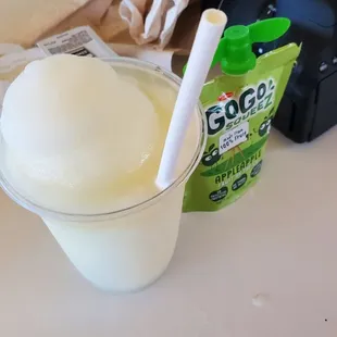 a glass of yogurt and a camera