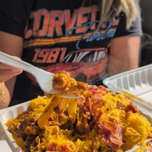 Chili cheese fries with bacon topped