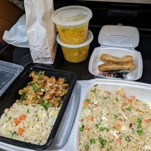 Fried rice, sesame chicken, egg drop soup, and crispy beef spring rolls