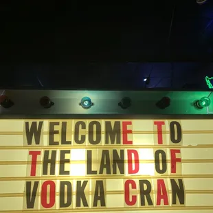 a sign that says welcome to the land of vodka gran