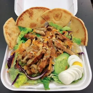 Fresh Grilled Chicken Salad, includes Pita Bread.