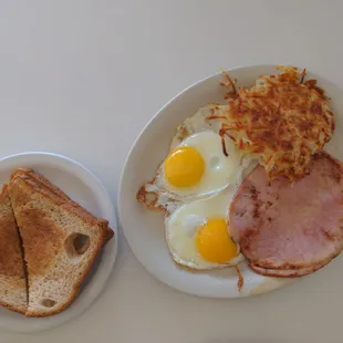 two plates of breakfast food