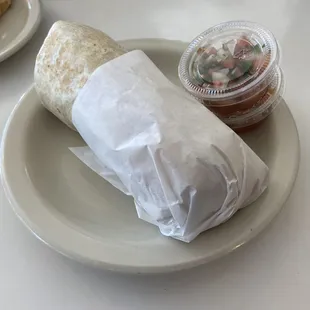 Breakfast burrito with bacon, hash brown and pico de Gallo