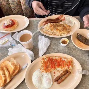 Breakfast: sausage and eggs with sourdough toast. Eggs with 2 sausage/bacon, hash brown, pancake and a decaf coffee.