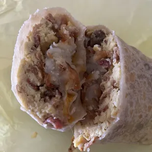 Sausage and bacon breakfast burrito.