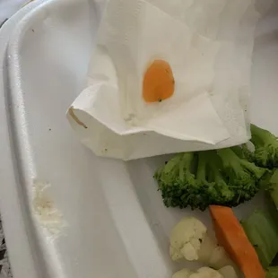 a piece of broccoli, carrots, and cauliflower