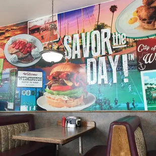 a restaurant with a large advertisement on the wall