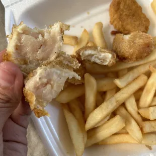 RAW chicken nugget. Disgusting. Will be reported to the health dept.