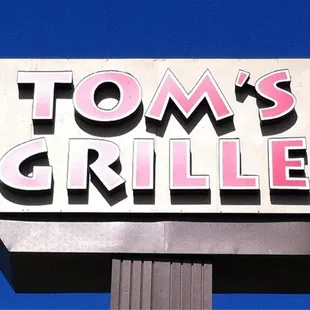 a sign for tom&apos;s grille