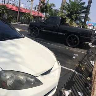 Dirty parking lot with poop stains on the walls.