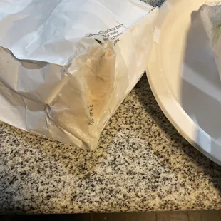 a burrito and a glass of water