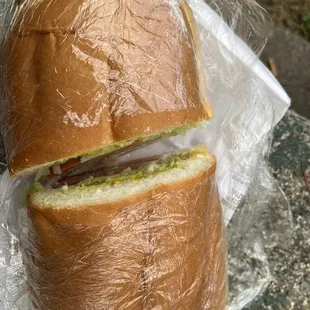 a sandwich wrapped in plastic