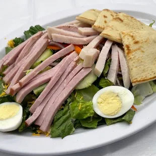 a salad with ham and hard boiled eggs