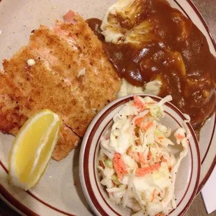 Salmon filet with mashed potatoes and coleslaw
