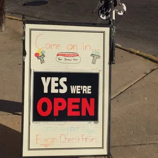 The &quot;we&apos;re open&quot; signage