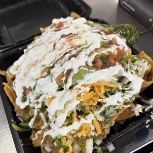 Behold the nachos with mix and match proteins