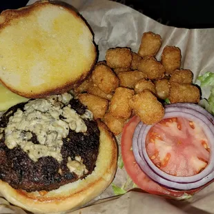a burger with a side of tater tots