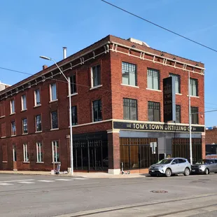 two cars parked in front of a building