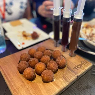 Donut holes with caramel, chocolate and raspberry injections