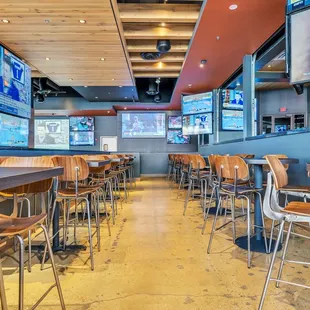 a view of the bar and televisions