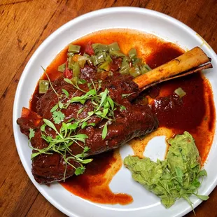 a plate of food on a wooden table