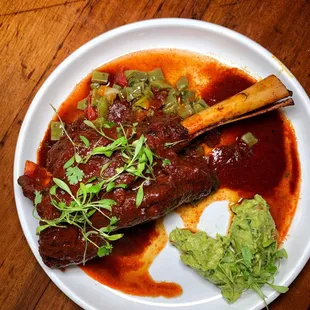 a plate of food on a wooden table