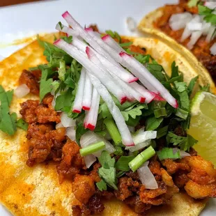 two tacos on a white plate