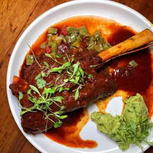 a plate of food on a wooden table