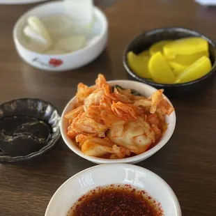 Complimentary sides: Cabbage kimchi, danmuji, onion with black bean sauce dipping and soy sauce+vinegar+red pepper flakes for dipping