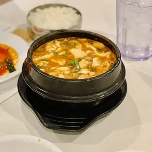 a hot pot of soup on a table