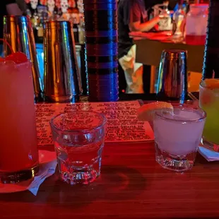 Left to right: Tequila Sunrise, Tequila shot, Lemon Drop Shot, Midori Sour