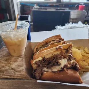 Cheese steak and a Painkiller!