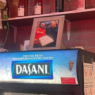 Inside (Toni is in the picture frame) -- Friday, 14 July 2023 at Toni's Pizza