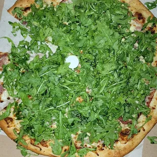 cheese pizza with a lb of arugula to top it off with some artisan style