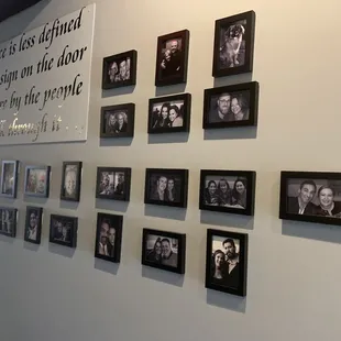 a wall full of family photos