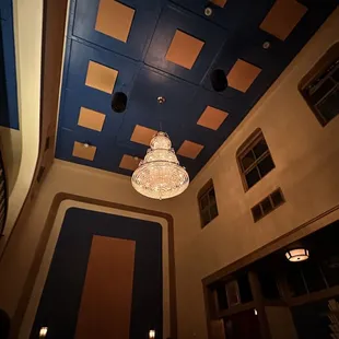 a chandelier hanging from the ceiling of a restaurant