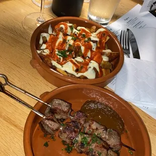Lamb skewers, sangria, papas bravas