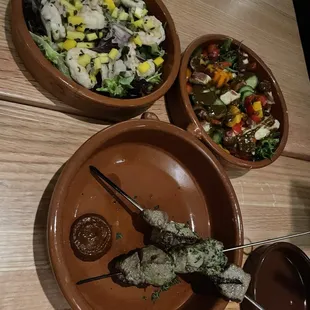 a variety of dishes of food on a table
