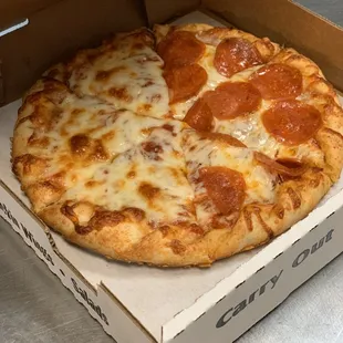 a pepperoni pizza in a box