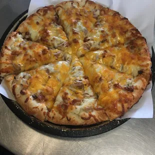 a cheese pizza on a pan